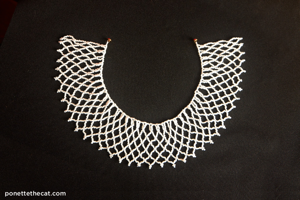 white beaded jabot